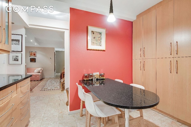 dining room featuring baseboards