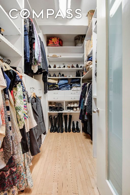 walk in closet featuring light wood-style flooring