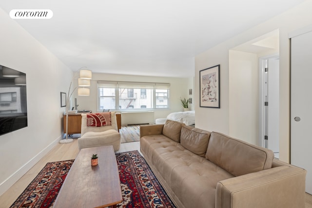 333 E 66th St Unit 5R, New York City, NY 10065 - living room with baseboards and light wood-style flooring