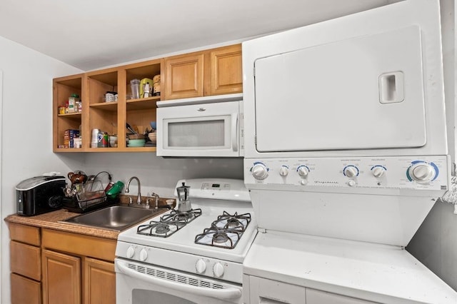 1741 73rd St, New York City, NY 11204 - kitchen with white appliances, stacked washer / dryer, light countertops, and brown cabinetry