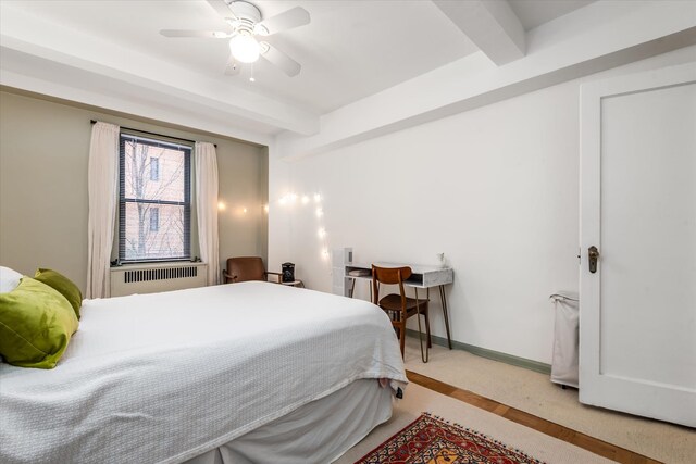 70 Park Ter W Unit E-23, New York City, NY 10034 - bedroom with beamed ceiling, light carpet, baseboards, and ceiling fan