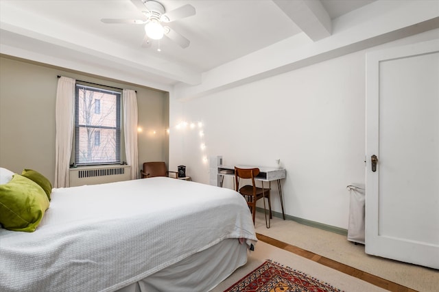 70 Park Ter W Unit E-23, New York City, NY 10034 - bedroom featuring beamed ceiling, light carpet, radiator, and a ceiling fan