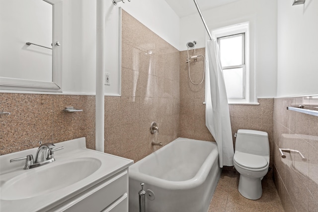 45-08 40th St Unit A42, New York City, NY 11104 - bathroom with tile walls, toilet, shower / tub combo, vanity, and wainscoting