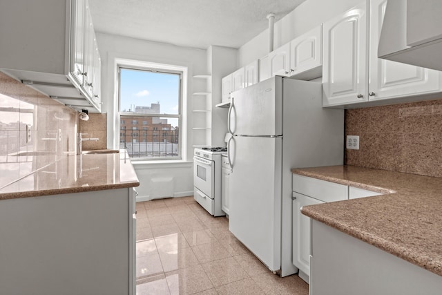 45-08 40th St Unit A42, New York City, NY 11104 - kitchen with white appliances, tasteful backsplash, white cabinetry, granite tiled floors, and light stone counters