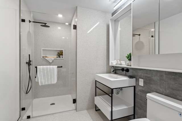 full bathroom with vanity, a stall shower, and toilet