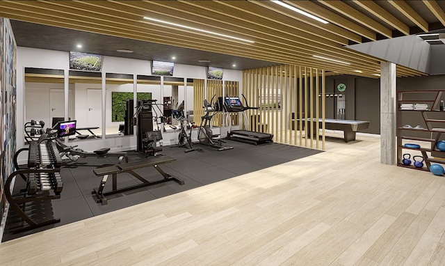 exercise room featuring wood finished floors