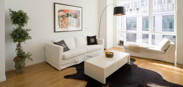 sitting room with wood-type flooring