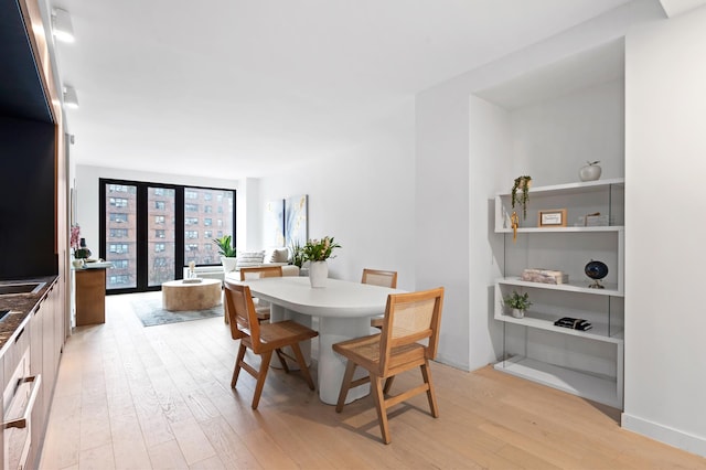 dining room featuring light wood finished floors