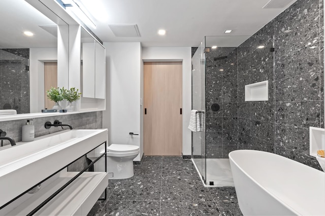 full bathroom with toilet, recessed lighting, vanity, a soaking tub, and a shower stall