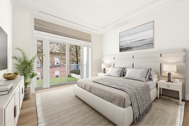 bedroom with light wood-type flooring and access to exterior