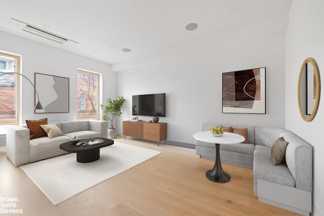 living room with visible vents and light wood finished floors