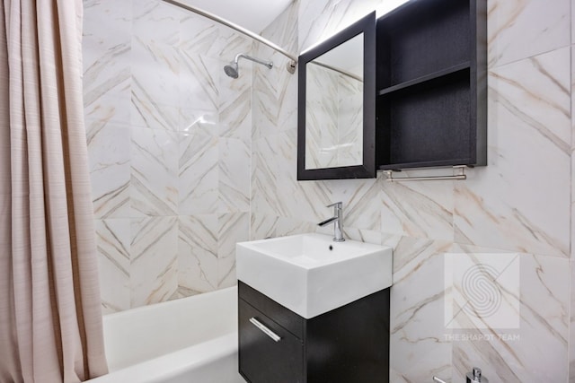 bathroom featuring vanity and shower / bathtub combination with curtain