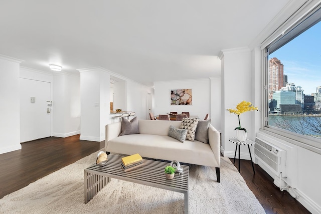 living area with baseboards, wood finished floors, a city view, and ornamental molding