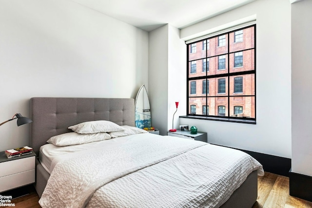 bedroom with wood finished floors