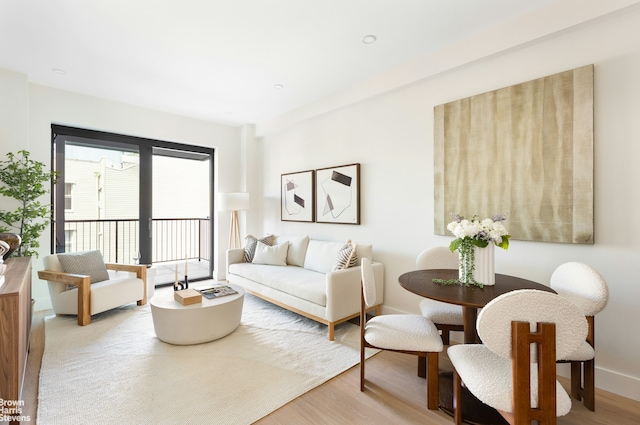 living area featuring wood finished floors and baseboards