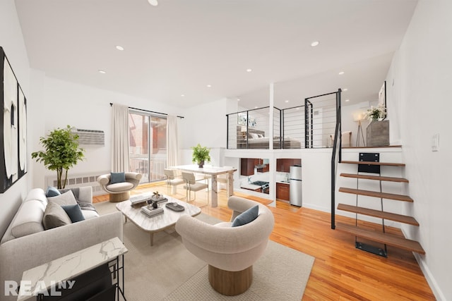 184 Thompson St Unit 5V, New York City, NY 10012 - living area featuring light wood finished floors, recessed lighting, and baseboards