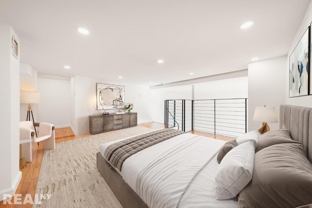 bedroom featuring light wood-style flooring and recessed lighting