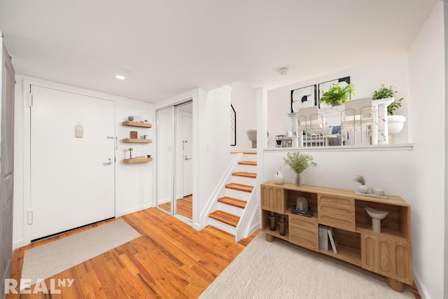 184 Thompson St Unit 5V, New York City, NY 10012 - foyer entrance with wood finished floors, stairway, recessed lighting, and baseboards