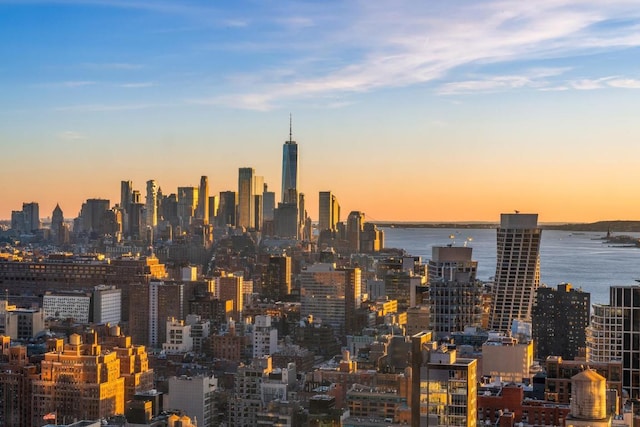 property's view of city with a water view