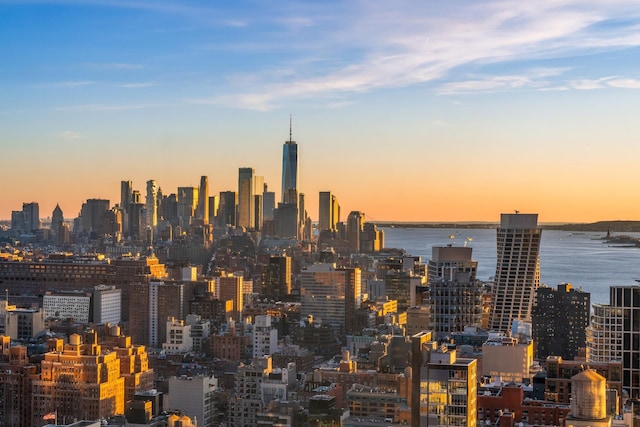 property's view of city featuring a water view