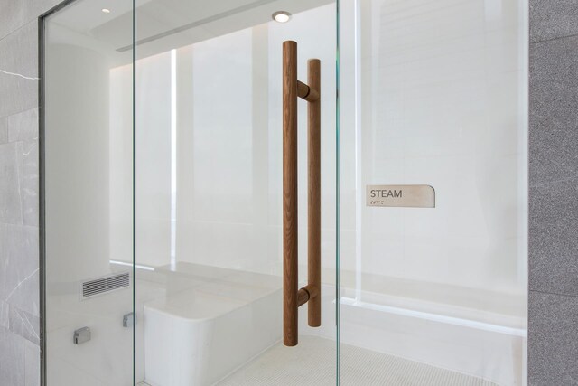 15 Hudson Yards Unit 38C, New York City, NY 10001 - bathroom featuring a stall shower and tile patterned flooring