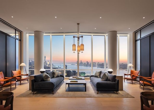 15 Hudson Yards Unit 38C, New York City, NY 10001 - living room featuring a wall of windows, wood finished floors, a city view, and a water view