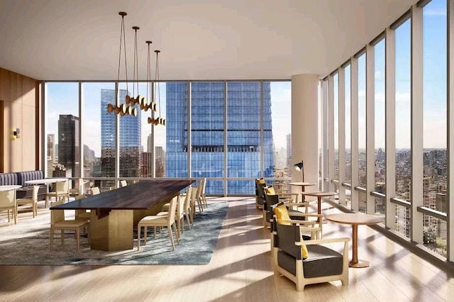 15 Hudson Yards Unit 38C, New York City, NY 10001 - dining area with a wall of windows, a skyline view, and wood finished floors