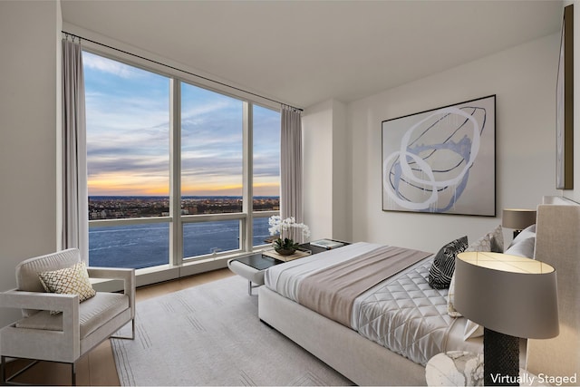 15 Hudson Yards Unit 38C, New York City, NY 10001 - bedroom with a water view, wood finished floors, floor to ceiling windows, and multiple windows