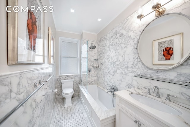 full bathroom featuring vanity, ornamental molding, toilet, tile walls, and shower / bath combination