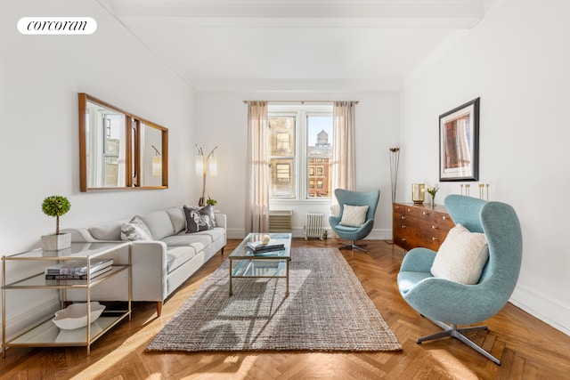 living room with radiator, visible vents, crown molding, and baseboards