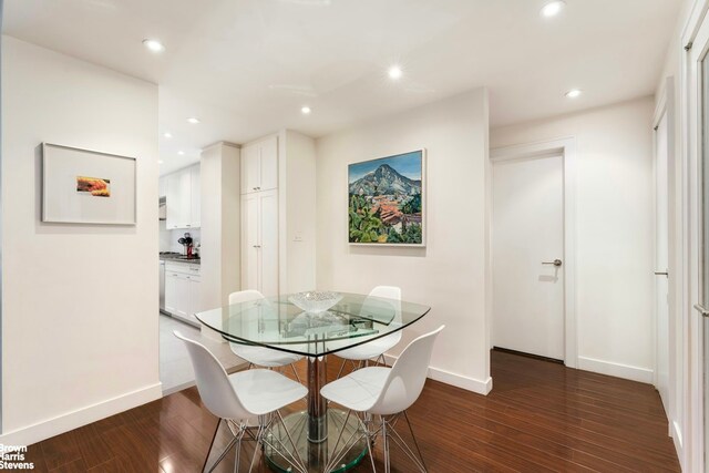 dining room featuring dark wood-style floors, baseboards, and recessed lighting