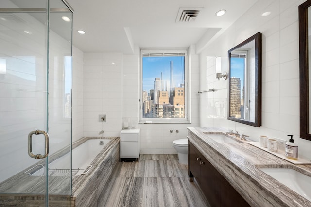 80 Riverside Blvd Unit Ph-1B, New York City, NY 10069 - full bathroom with tile walls, plenty of natural light, a garden tub, toilet, and a shower stall