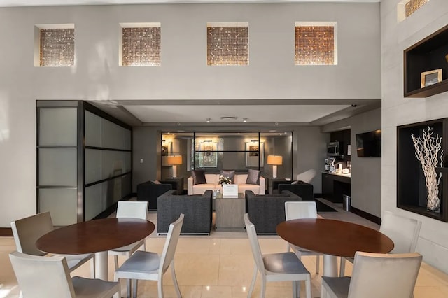 80 Riverside Blvd Unit Ph-1B, New York City, NY 10069 - dining area with light tile patterned floors and a high ceiling