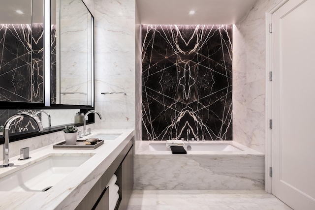 108 Leonard St Unit 7H, New York City, NY 10013 - bathroom with double vanity, a garden tub, and marble tiled floors