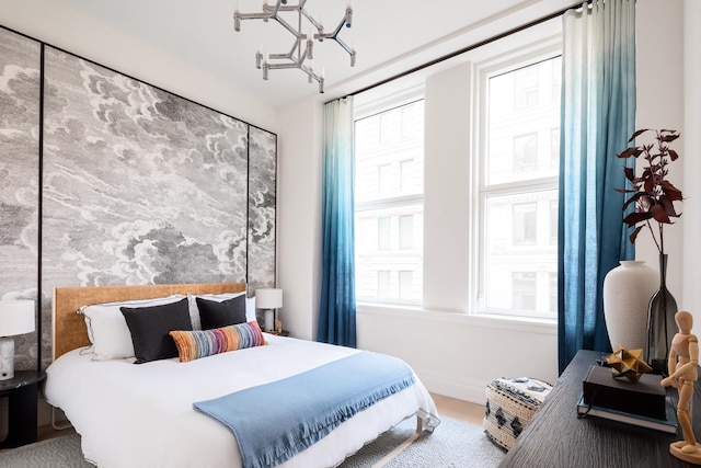 108 Leonard St Unit 7H, New York City, NY 10013 - bedroom with multiple windows, a chandelier, and baseboards