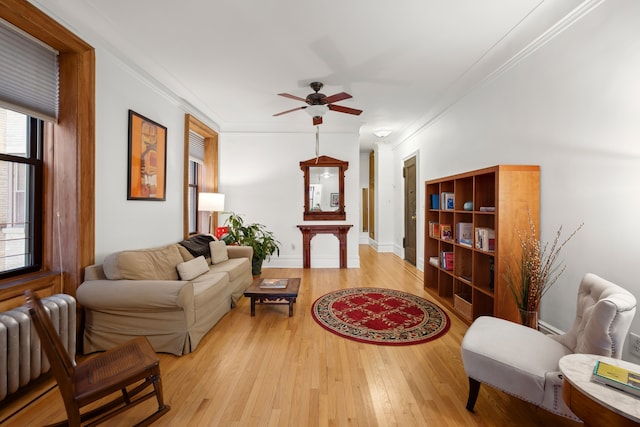 790 Riverside Dr Unit 6-C, New York City, NY 10032 - living room featuring radiator, light wood-style flooring, a ceiling fan, ornamental molding, and baseboards