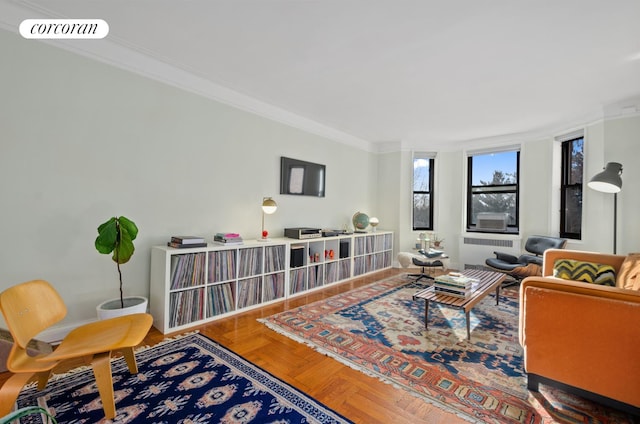 living room with visible vents, radiator heating unit, and crown molding