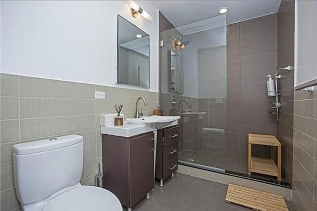5-43 48th Ave Unit 3A, New York City, NY 11101 - full bath with tile walls, vanity, tiled shower, and tile patterned floors