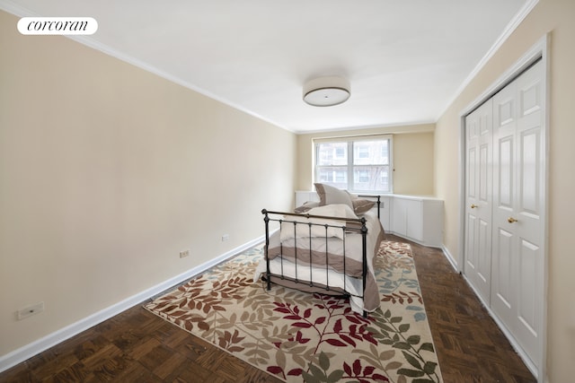 233 E 69th St Unit 3L, New York City, NY 10021 - bedroom with baseboards, crown molding, and a closet