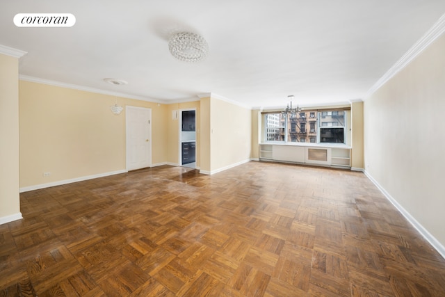 unfurnished living room featuring baseboards, visible vents, a chandelier, and crown molding