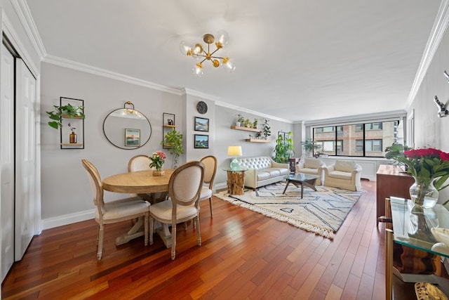 dining room featuring crown molding, dark wood finished floors, and an inviting chandelier