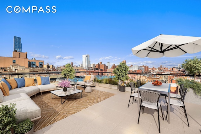 view of patio featuring an outdoor living space and a city view