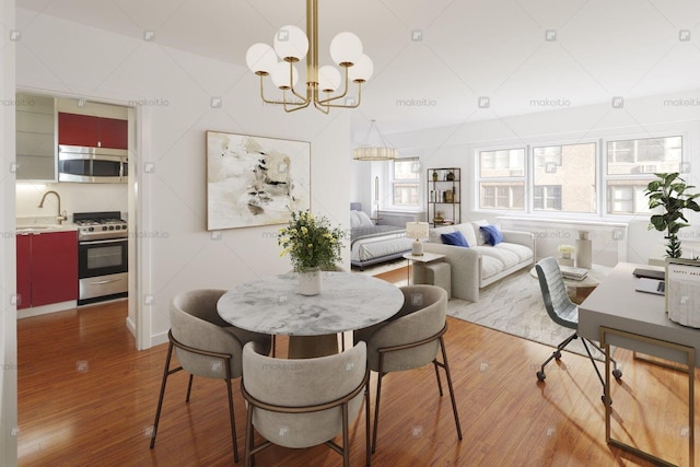 dining space with a notable chandelier and wood finished floors