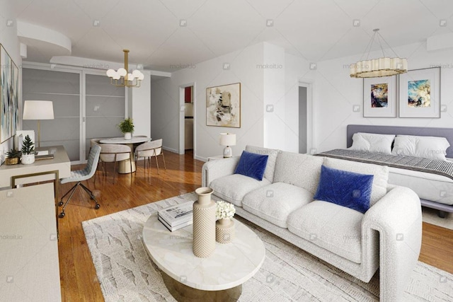 living area with a notable chandelier and wood finished floors