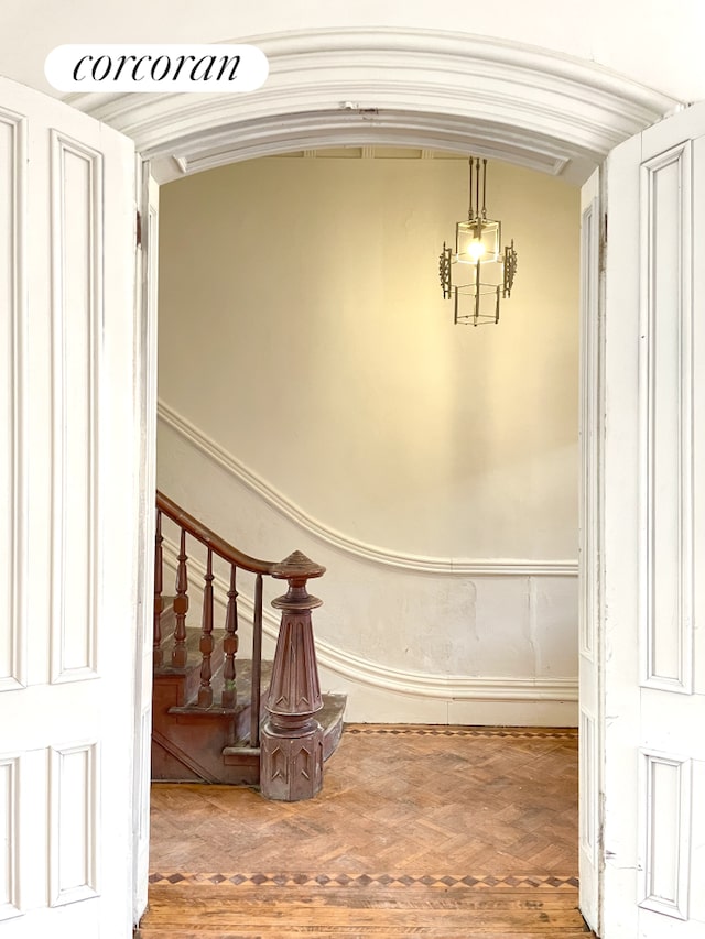 stairway featuring wood finished floors