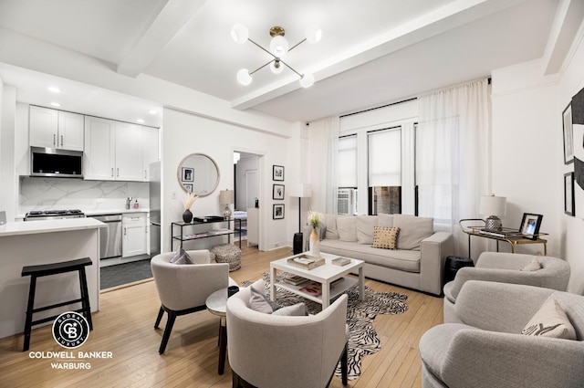 living area featuring beamed ceiling, recessed lighting, and light wood-style flooring