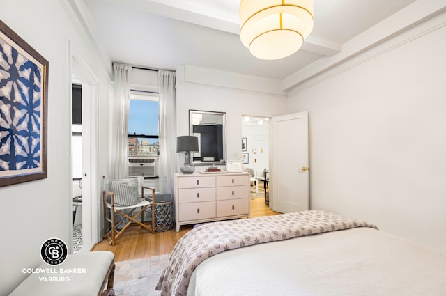 bedroom with light wood-style floors and cooling unit