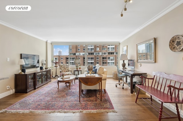 living area featuring baseboards, crown molding, visible vents, and wood finished floors