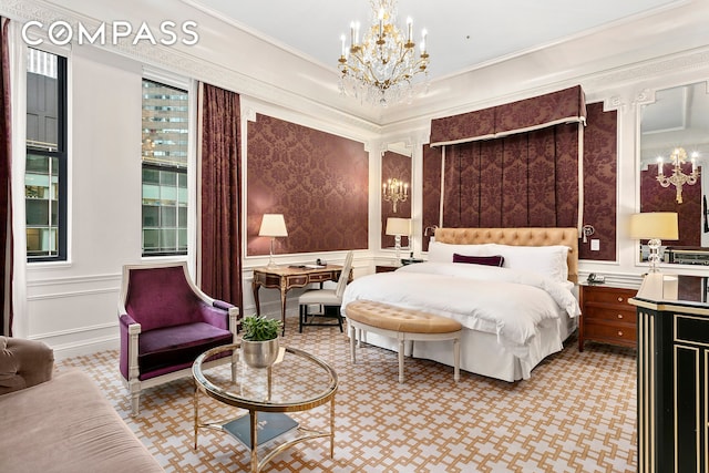 bedroom with a notable chandelier, ornamental molding, and a decorative wall