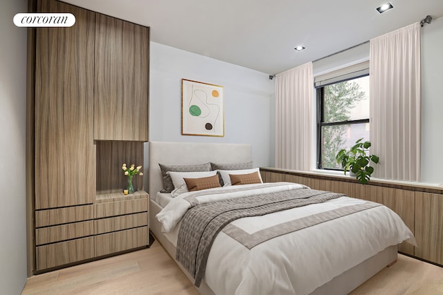 bedroom featuring light wood finished floors